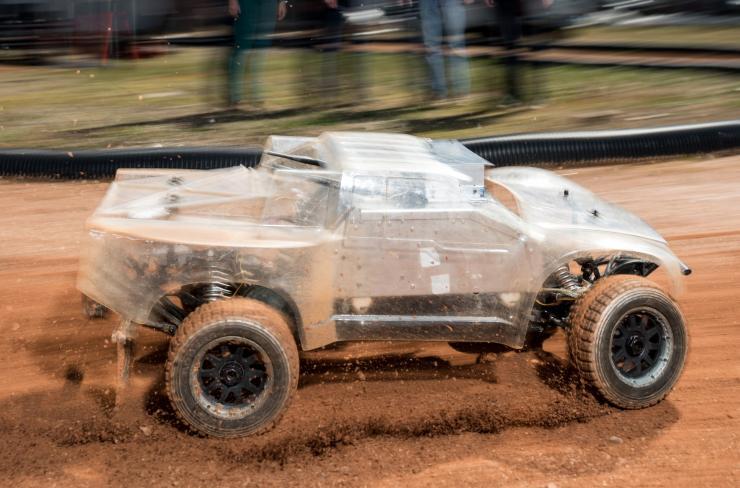 <p>At the Georgia Tech Autonomous Racing Facility, researchers are studying a one-fifth-scale autonomous vehicle as it traverses a dirt track. The work will help the engineers understand how to help driverless vehicles face the risky and unusual road conditions of the real world. (Credit: Rob Felt, Georgia Tech)</p>