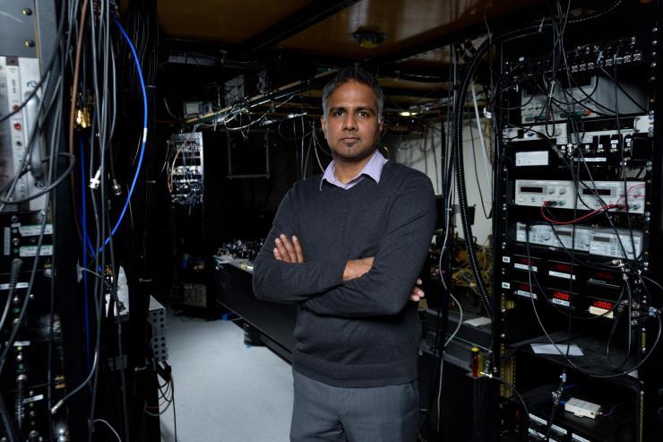 <p>Chandra Raman, an associate professor in the Georgia Tech School of Physics, is shown in his laboratory with equipment used to study Bose-Einstein condensates. (Credit: Rob Felt, Georgia Tech).</p>