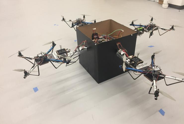 <p>Researchers have developed a modular solution for handling larger packages without the need for a complex fleet of drones of varying sizes. By allowing teams of small drones to collaboratively lift objects using an adaptive control algorithm, the strategy could allow a wide range of packages to be delivered using a combination of several standard-sized vehicles. (Credit: John Toon, Georgia Tech)</p>