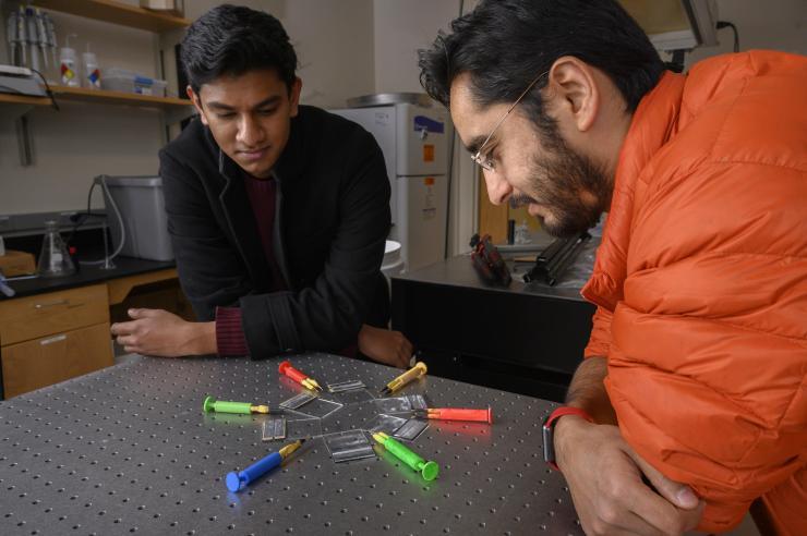Georgia Tech undergraduate student Gaurav Byagathvalli and Assistant Professor Saad Bhamla with examples of the inexpensive ElectroPen – an electroporator device useful in life sciences research. (Credit: Christopher Moore, Georgia Tech)