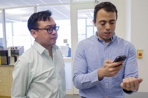 <p>Graduate student <strong>Rob Mannino</strong> (right), pictured with <strong>Wilbur Lam</strong> (left) was able to refine and tweak technology for anemia detection by using himself as a test subject. Photo by Christopher Moore, Georgia Tech.</p>