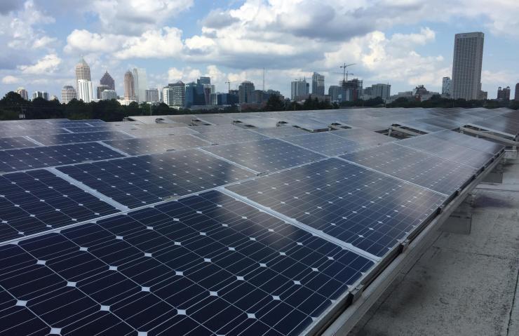 <p>Rows of photovoltaic panels are shown atop a building on the Georgia Institute of Technology campus in Atlanta. A new technique under development could potentially improve the efficiency of solar cells. (Credit: John Toon, Georgia Tech)</p>