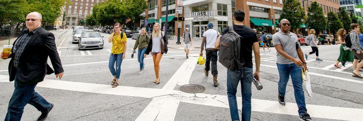 <p>People crossing the intersection in front of the Georgia Tech bookstore</p>