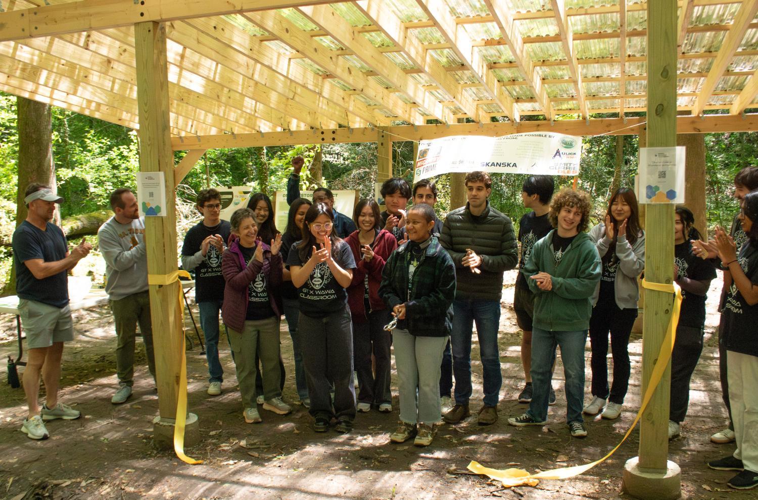 The Building for Equity and Sustainability undergraduate research class celebrates the opening of the outdoor classroom that they designed and built with the West Atlanta Watershed Alliance in Bush Mountain (April 14, 2025). 