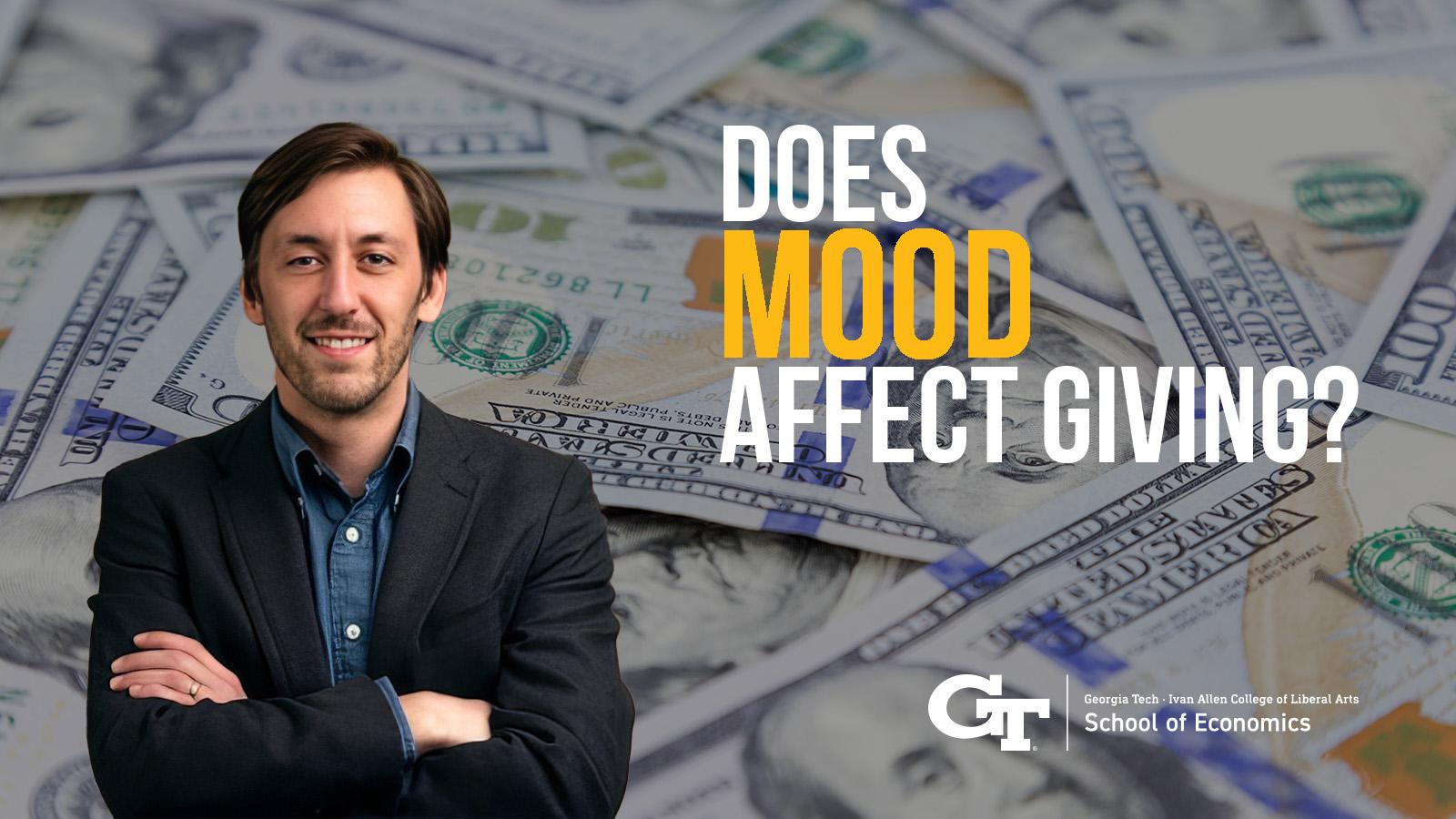 Photo illustration of a man standing with his arms folded against a backdrop of money and the words 'Does Mood Affect Giving?'
