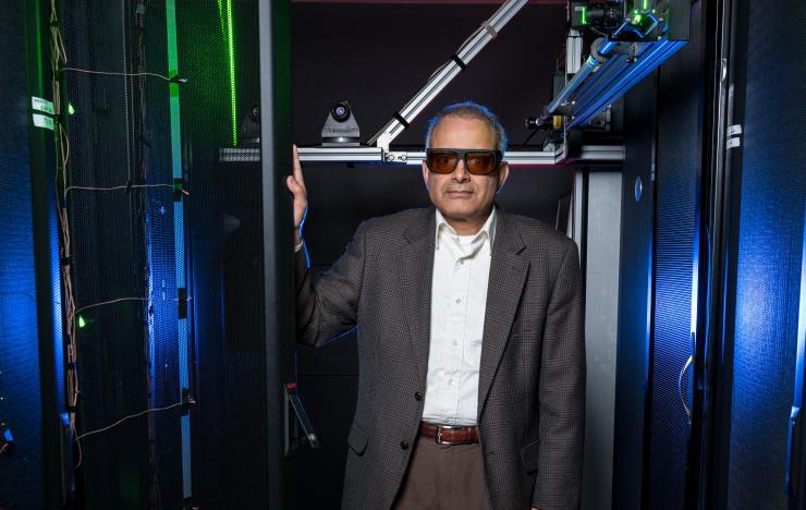 <p>Georgia Tech’s data center simulator uses lasers, wireless sensors, and other equipment to study air flow and cooling in server racks. Shown is Yogendra Joshi, a professor in Georgia Tech’s School of Mechanical Engineering. (Credit: Rob Felt, Georgia Tech)</p>