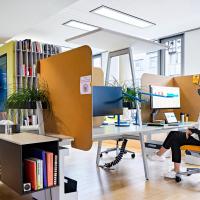 A furnished office environment with furniture designed by Steelcase.