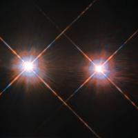 The Alpha Centauri group is the closest star - or solar - system outside of our own at a distance of 4.3 lightyears, and it can be found in the night sky in the constellation Centaurus. The stars Alpha Centauri A and Alpha Centauri B comprise a binary system, in which the two stars orbit one another, and close by is an additional faint red dwarf star, Alpha Centauri C, also called Proxima Centauri. Some astronomers have hoped to someday find an exoplanet capable of harboring advanced life in the system, but