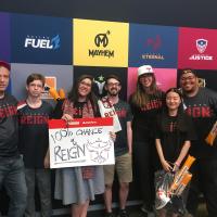 A Georgia Tech VIP class team attending an esports event in Los Angeles in 2019 with Laura Levy (holding the sign). 