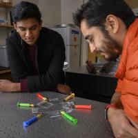 Georgia Tech undergraduate student Gaurav Byagathvalli and Assistant Professor Saad Bhamla with examples of the inexpensive ElectroPen – an electroporator device useful in life sciences research. (Credit: Christopher Moore, Georgia Tech)