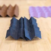 <p>A new type of origami can morph from one pattern into a different one, or even a hybrid of two patterns, instantly altering many of its structural characteristics. (Credit: Allison Carter)</p>