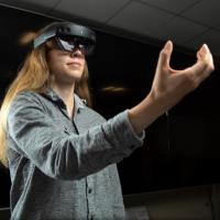 <p>GTRI Research Scientist Emily Strube (pictured) said that in addition to the battlefield, her team is also looking to incorporate this research into smart warehouses and to help users locate and manuever around chemical hazards (Photo Credit: Christopher Moore, GTRI).</p>