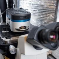 <p>An atomic force microscope allows scientists to observe molecular interactions important to understanding life processes. Georgia Tech mechanical engineers focusing on biotechnology recently significantly improved AFM's sensitivity by adding electronic white noise. Credit: Georgia Tech /  Rob Felt</p>