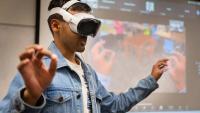 Georgia Tech student Yash Rajgure using an Apple Vision Pro headset device to demo his team's project.