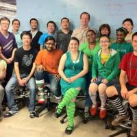 <p>Group photo of BBISS students and staff wearing St. Patrick's Day regalia, mostly goofy socks.</p>