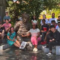 <p>Group photo of the participants of the 2022 Energy Unplugged summer camp on the Georgia Tech Atlanta campus staged around the Einstein bench statue/installation.</p>