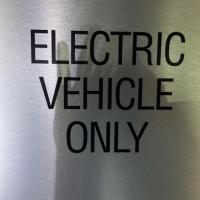 <p>Drivers of electric vehicles look for signs like this one to indicate the location of charging stations.</p>