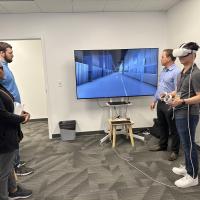 Georgia Tech student trying the virtual reality software systems at the Valmet Lab