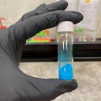 <p>The vial shown contains a blue powder, HKUST-1, a metal-organic framework (MOF) material. (Credit, Tania Evans, Georgia Tech)</p>