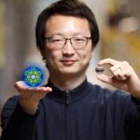 <p>Researcher Xiaojian Bai and his colleagues used neutrons at ORNL’s Spallation Neutron Source to discover hidden quantum fluctuations in a rather simple iron-iodide material discovered in 1929. The research suggests many similar magnetic materials could have quantum properties that are waiting to be discovered. (Credit: ORNL/Genevieve Martin)</p>