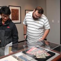 <p>Papermaking Museum: RBI Fellows Xirui Peng, ME, and Daniel Kimmel, ME, view papers on display during the opening of 'Marvelous Marbling: Demystifying Marbled Papers'</p>