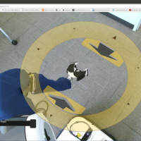 <p>Image shows the view through the PR2’s cameras showing the environment around the robot. Clicking the yellow disc allows users the control the arm. (Credit: Phillip Grice, Georgia Tech)</p>