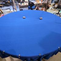 <p>Two small robots move on a stretchy, trampoline-like surface.</p>