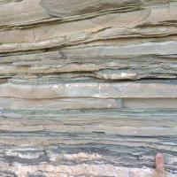 <p>Close-up view of layered sedimentary rocks representative of those used in this study. Each layer records a snapshot of the Earth system over millions to billions of years. Credit: Georgia Tech / Yale - Reinhard / Planavsky</p>