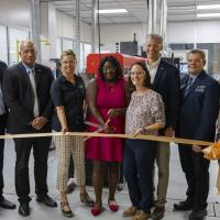 Partners of the facility gathered for an official ribbon cutting ceremony. 