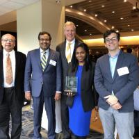 <p>South Big Data Hub recieved the Outstanding Research Award from the Institute and are shown holding the award alongside Georgia Tech President Bud Peterson.</p>