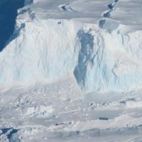 <p>Thwaites Glacier's outer edge. As the glacier flows into the ocean, it becomes sea ice and drives up sea-level. Thwaites Glacier's ice is flowing particularly fast, and some researchers believe it may have already tipped into instability or be near that point, though this has not yet been established. Credit: NASA/James Yungel</p>