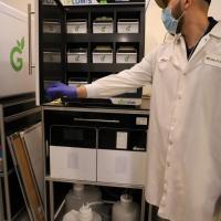 TipCycle project manager Adam Fallah demonstrates how Grenova's pipette tip washing system operates.