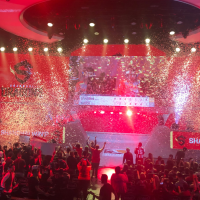 Crowd celebrating the winner at an esports event