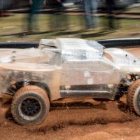 <p>At the Georgia Tech Autonomous Racing Facility, researchers are studying a one-fifth-scale autonomous vehicle as it traverses a dirt track. The work will help the engineers understand how to help driverless vehicles face the risky and unusual road conditions of the real world. (Credit: Rob Felt, Georgia Tech)</p>