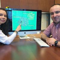 <p>Georgia Tech Doctoral Student Maria Juliana Soto-Girón and School of Civil and Environmental Engineering Professor Kostas Konstantinidis are shown with images of bacteria. Research done with scientists from the U.S. Environmental Protection Agency documented bacteria in shower hoses taken from hospital patient rooms. (Credit: John Toon, Georgia Tech).</p>