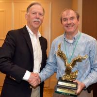 <p>Professor Matthew Realff Receives the Carpet America Recovery Effort Person of the Year Award from CARE representative.</p>