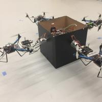 <p>Researchers have developed a modular solution for handling larger packages without the need for a complex fleet of drones of varying sizes. By allowing teams of small drones to collaboratively lift objects using an adaptive control algorithm, the strategy could allow a wide range of packages to be delivered using a combination of several standard-sized vehicles. (Credit: John Toon, Georgia Tech)</p>