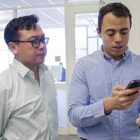 <p>Graduate student <strong>Rob Mannino</strong> (right), pictured with <strong>Wilbur Lam</strong> (left) was able to refine and tweak technology for anemia detection by using himself as a test subject. Photo by Christopher Moore, Georgia Tech.</p>