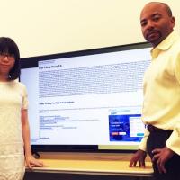 <p>Georgia Tech Ph.D. student Xiaojing Liao and Professor Raheem Beyah are shown with a typical promotional infection, this one advertising essays for sale. (Credit: John Toon, Georgia Tech).</p>
