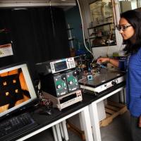<p>Akanksha Menon, a Ph.D. student in the Woodruff School of Mechanical Engineering at the Georgia Institute of Technology, measures electrical conductivity of a thermoelectric polymer film device. (Credit: Candler Hobbs, Georgia Tech).</p>