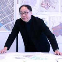 <p>Perry Yang with Tokyo Smart City designs, in the Eco Urban Lab</p>