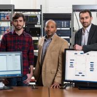 <p>Researchers at the Georgia Institute of Technology are “fingerprinting” devices on the electric grid to improve security. Shown with grid devices and a schematic are (L-R) graduate student David Formby, Associate Professor Raheem Beyah and Assistant Professor Jonathan Rogers. (Credit: Rob Felt, Georgia Tech)</p>