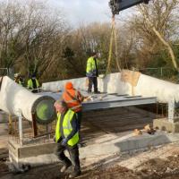 Blade bridge under construction in Ireland, used two repurposed wind turbine blades as major structural components.  Photo credit: Re-Wind Network