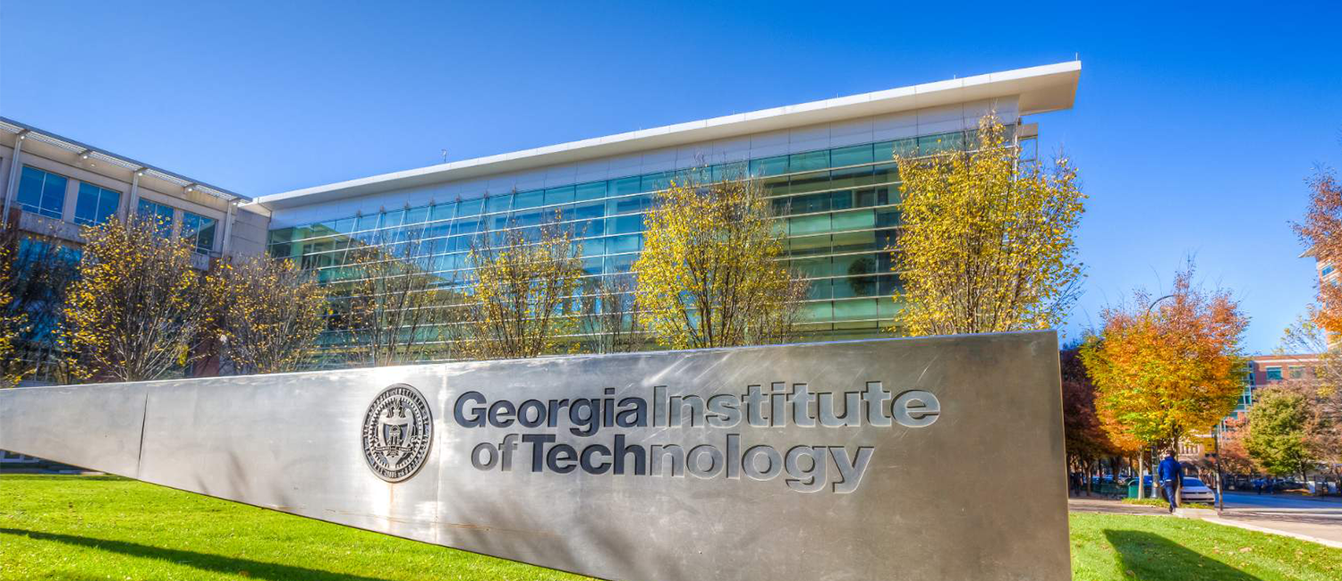 photo of Georgia Tech campus with large sign with GT name and GT seal